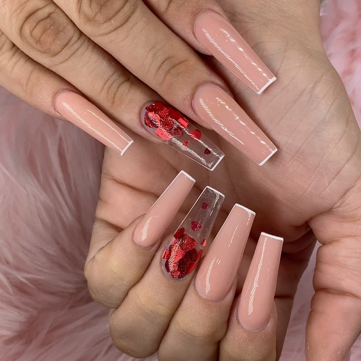nude and ruby red heart nails