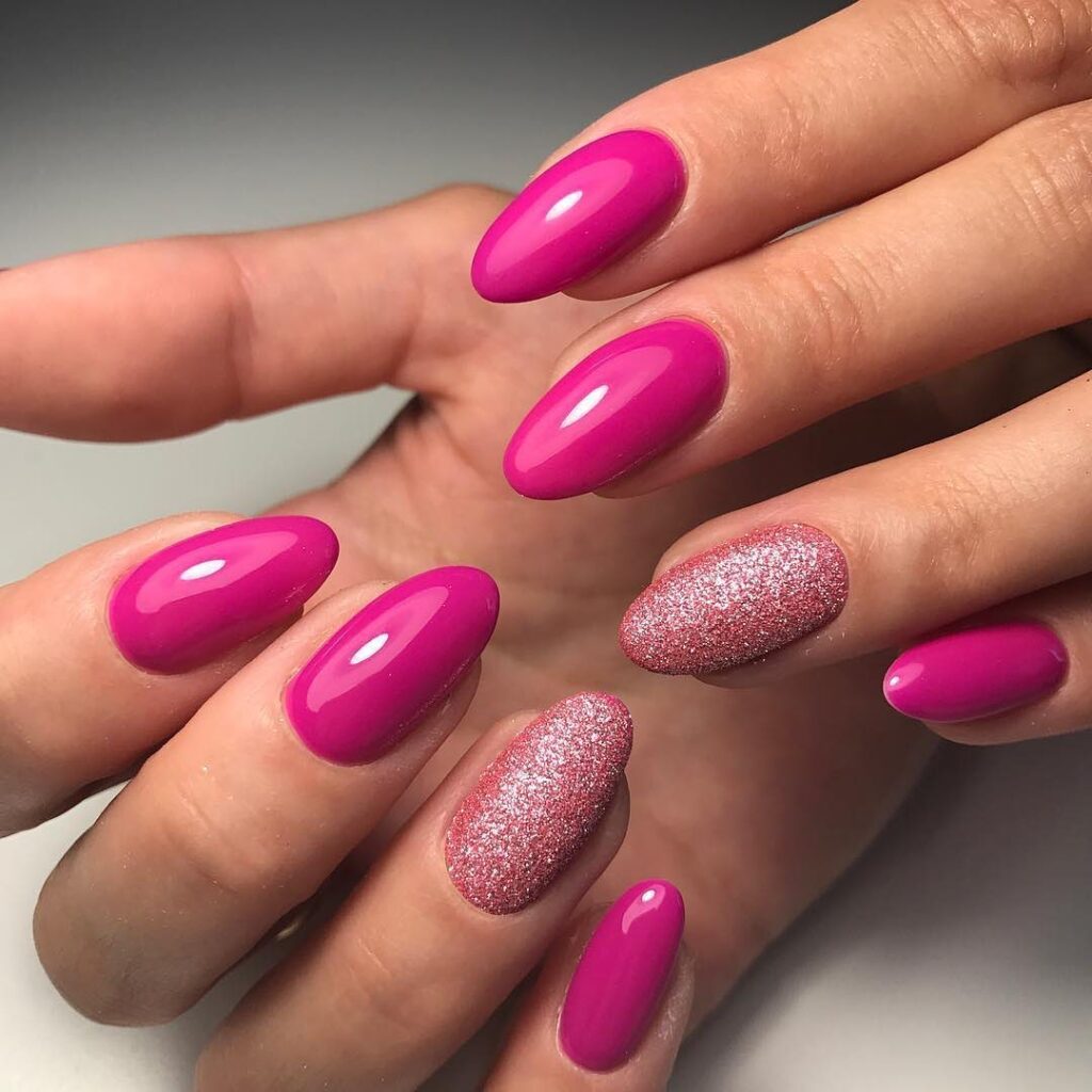 11-Hot Pink and Glittery Almond Nails