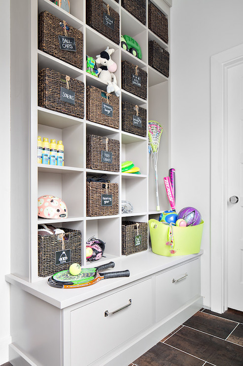 Basement-playroom-built-in-cabinets-toy-storage-wicker-toy-bins
